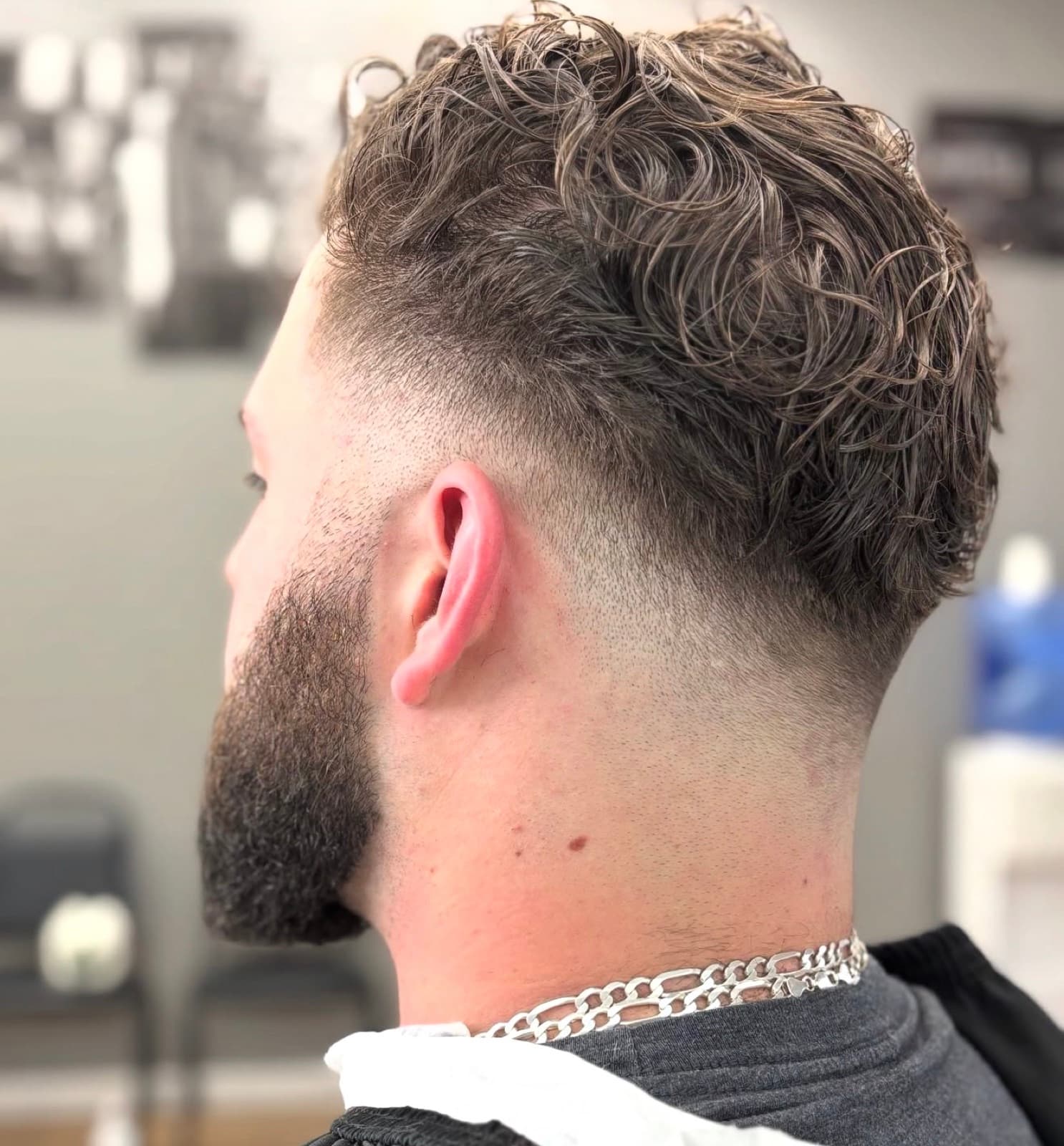 Curly top finished with a taper