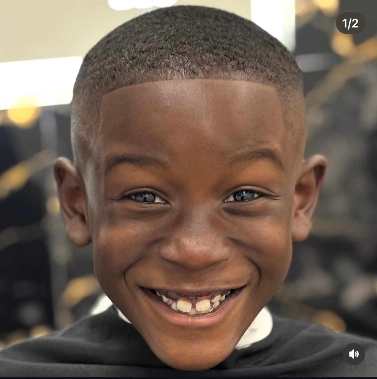 Smiling young client after a fresh haircut